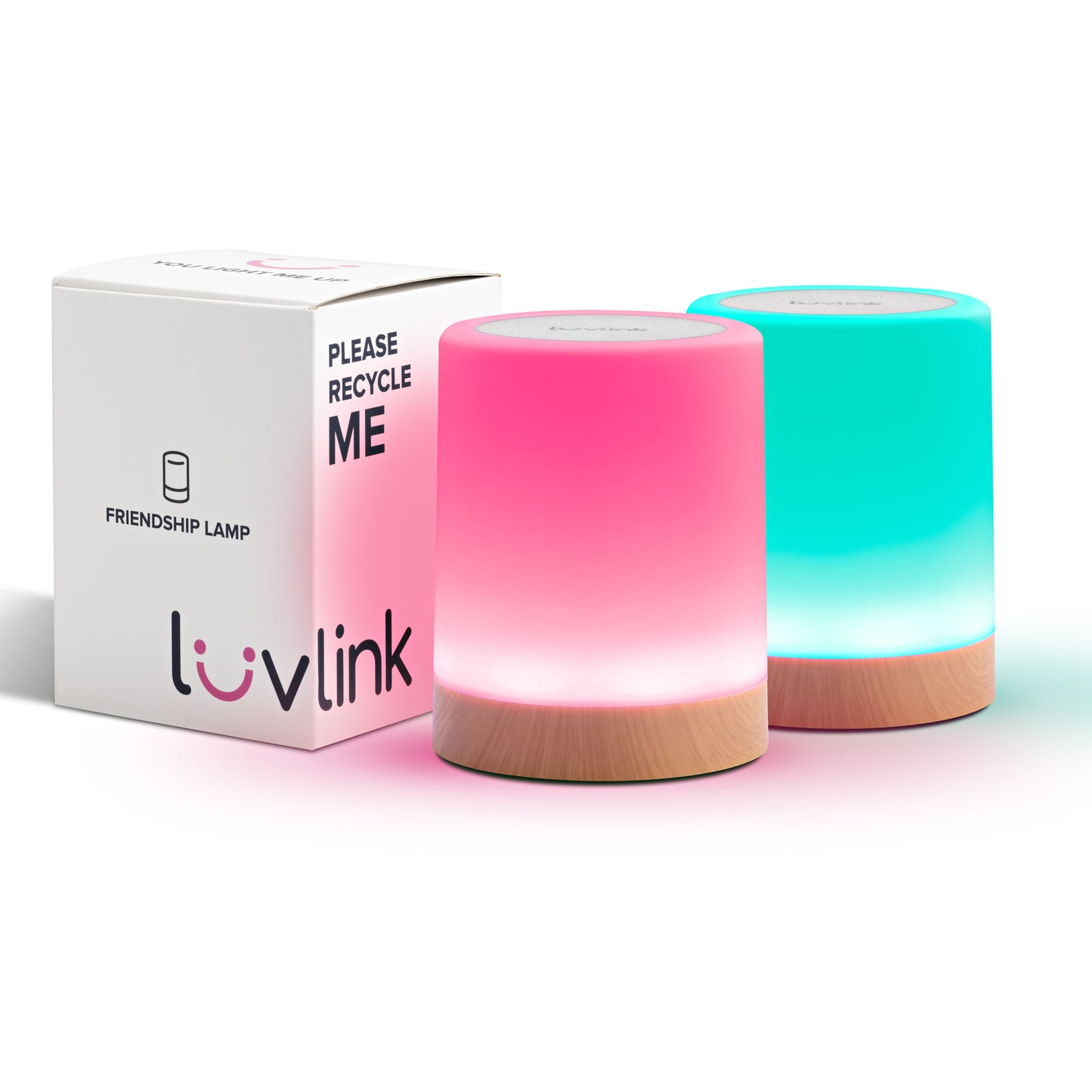 Two glowing LuvLink Friendship Lamps with wooden bases in pink and turquoise beside their recyclable white product box.
