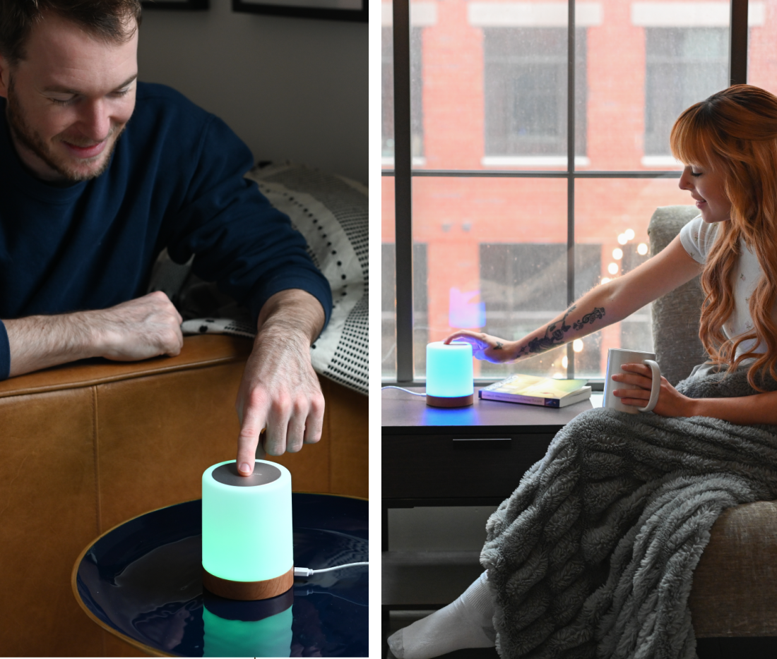 Two people in separate locations touching glowing LuvLink Friendship Lamps that illuminate to connect them across distance.